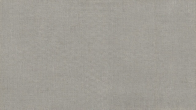 A close-up, full-frame view of a textured, light gray woven fabric surface.