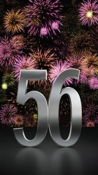 Silver number 56 with fireworks in the background. Festive scene for birthday or anniversary party