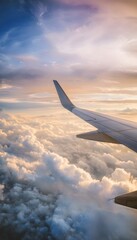 Obraz premium Golden sunrise paints a serene aerial view of clouds and airplane wingtip majesty