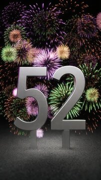 Silver number 52 with fireworks in the background. Festive scene for birthday or anniversary party