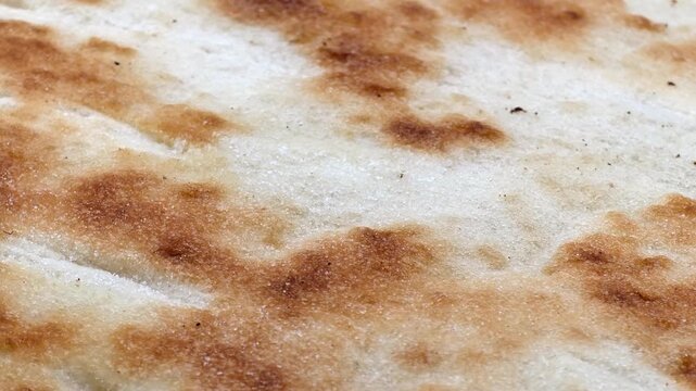 Baked pizza dough with crunchy crust texture close up. Baking, food preparation, eating background