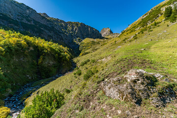 Obraz premium Majestic Mutterwangsjoch Trail Reveals Serene Alpine Valley Beauty in Vorarlberg Austria
