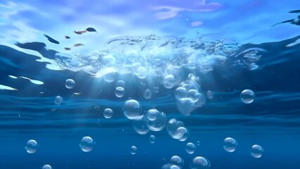 Dynamic underwater bubbles rising to sunlit surface in crystal clear ocean waters