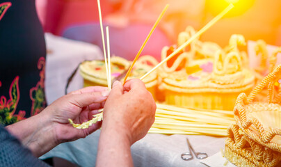 Artisan crafts intricate handmade baskets using natural materials in a vibrant workshop setting