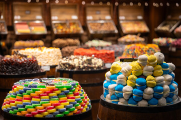 A confectionery store filled with various types of traditional Turkish delight (lokum), creating a beautiful and abundant display of colorful sweets throughout the shop.

