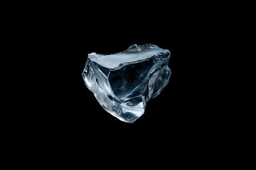 Transparent ice chunk isolated on black background closeup abstract clean cool cold crystal design element detail frozen frost glistening light natural object purity refreshing texture water