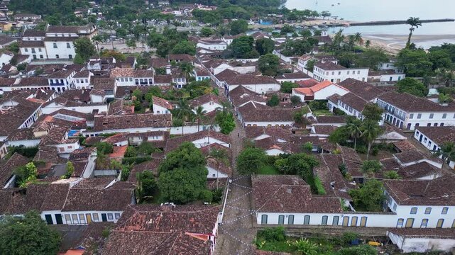 Paraty, Brazil: Aerial drone footage of Paraty, an old town in state of Rio de Janeiro, Brazil shot with a forward motion showing the street in historic town center