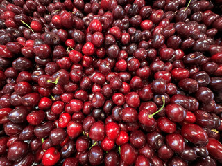 fresh red cherries , healthy food background