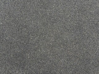 Fototapeta premium Small dark grey gravel granular texture full frame surface background