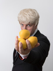 Man with lemons in his hands. Lemon man. Work. Business concept. Working 