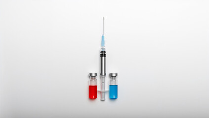 A syringe with two vials of different colored liquids, representing vaccination, healthcare, and medicine