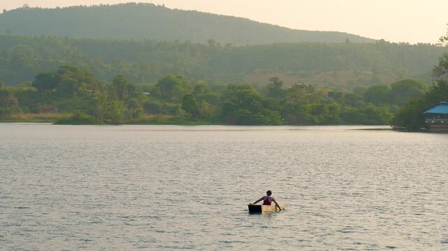 Aerial View of a Man Rowing a Traditional Canoe (&ldquo;Catraia&rdquo;) Transporting Passengers Across the Tapaj&oacute;s River to the Beach at Alter do Ch&atilde;o, Santar&eacute;m, Par&aacute;, Brazil