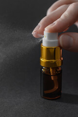Perfume atomizer close-up, spray with atomizer