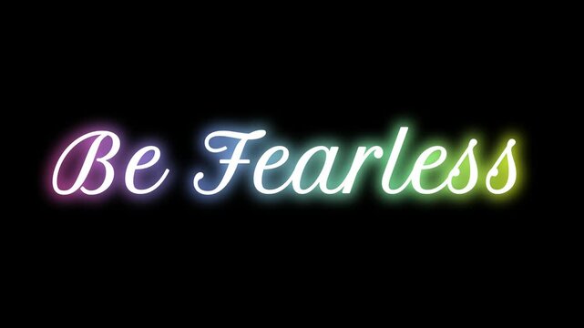 Inspiring message "Be Fearless" glows with vibrant rainbow neon lights against a solid black background