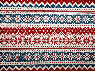 A close up view of a knitted textile with a traditional fair isle pattern