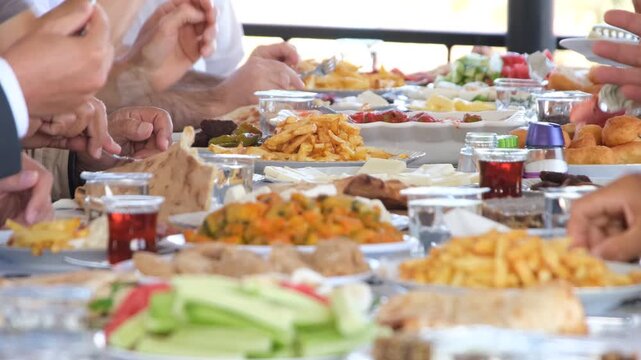 Group Of People Sharing Traditional Turkish Dinner Table