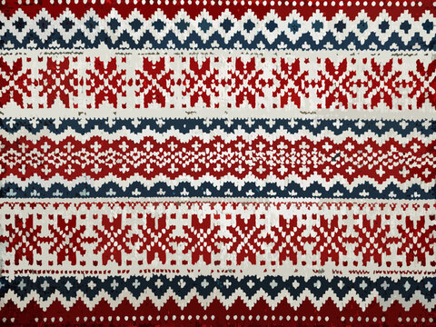 Close up of a knitted fabric showcasing a traditional fair isle pattern