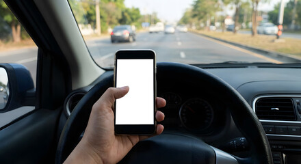 A businessman holding a smartphone with a clear display screen while driving an auto on the road, using mobile communication technology and GPS for smart navigation at the wheel