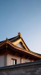Fototapeta premium Traditional Chinese Temple Roof with Intricate Design Under Clear Blue Sky