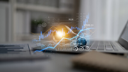A modern workspace featuring a laptop with glowing analytical data overlays, including financial charts and graphs, symbolizing business growth and technological innovation. Scalp