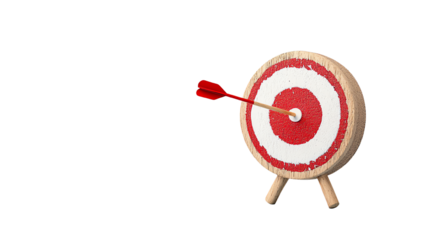 A wooden target with a dart hitting the bullseye, representing success and achievement in business or goal-oriented contexts.