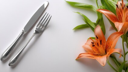 Elegant silverware and vibrant orange lilies create a refined dining aesthetic.