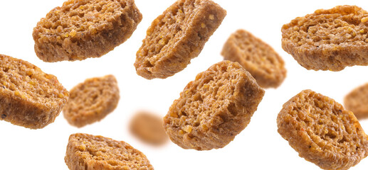 Bread croutons levitate on a white background