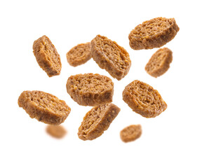 Bread croutons levitate on a white background