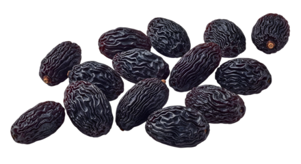 Collection of wrinkled black dates arranged closely together isolated on transparent background