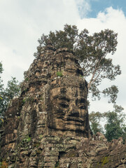 Fototapeta premium Serene Bayon Stone Face At Angkor Thom, Cambodia Heritage Temple Landmark