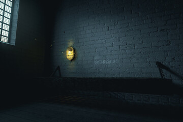3d rendering of grunge prison cell with bed and flying moths around the cell lighting