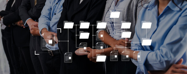 Group of business professionals lined up in formal attire with a digital data flow graphic overlay, emphasizing teamwork and modern digital transformation in workplaces. Trope