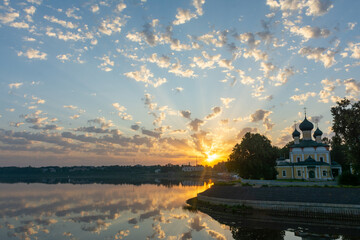 The Cathedral building in the rays of the rising sun in the Kremlin of the city of Uglich on the banks of the Volga River.	