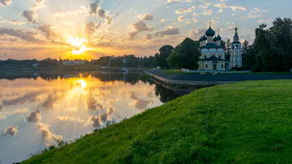 The Cathedral building in the rays of the rising sun in the Kremlin of the city of Uglich on the banks of the Volga River.	