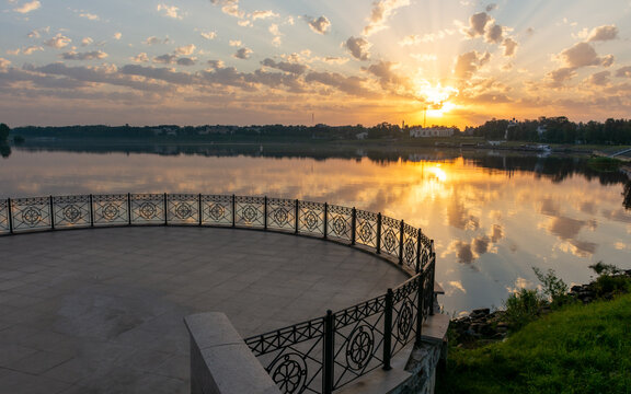 A view of the sunrise over the Volga River and an observation deck in the city of Uglich