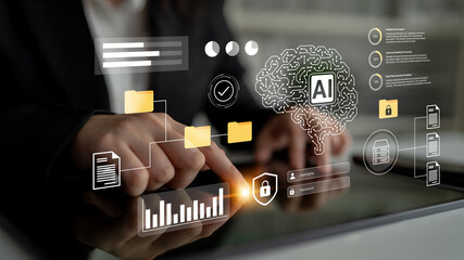 Close-up of hands using a tablet with a digital interface displaying AI, data security symbols, and analytics, showcasing technology impact on modern business practices. Gantry