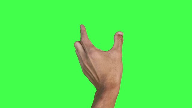Footage of a human hand performing screen zoom gestures such as pinch to zoom in and zoom out using two fingers on a green screen background. Ideal for digital UI, app tutorials