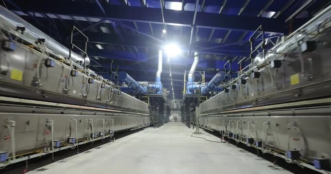 Modern roller kiln (tunnel furnace) for firing ceramic tiles and porcelain tiles. A production line or conveyor at a ceramic and porcelain tile factory. Ceramic Tile Making.