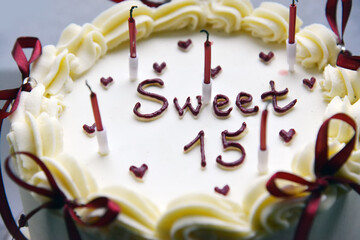 Sweet Fifteen Birthday Cake with Candles and Cream Decoration