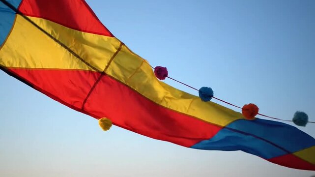 A vibrant kite soaring in a clear blue sky, evoking joy and adventure.