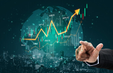 A businessman points at a digital financial graph showing upward growth against a global background, representing economic development and investment potential in today dynamic market. Scalp