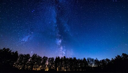 Naklejka premium Milky Way galaxy over forest silhouette evokes cosmic wonder, low light beauty, and astrophotography brilliance