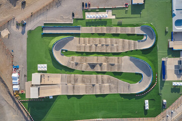 Fototapeta premium Empty bmx supercross track with multiple ramps and turns awaiting competition