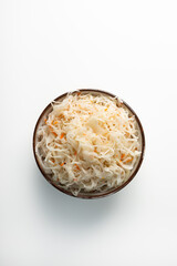 Top view of fermented cabbage in bowl healthy food close up