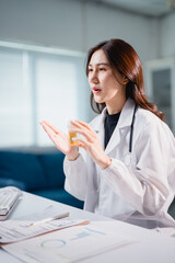 Asian doctor explaining medication during online telemedicine consultation
