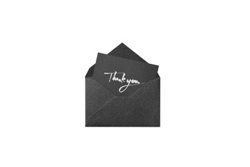 white handwritten thank you card from a black glitter envelope, overhead view	