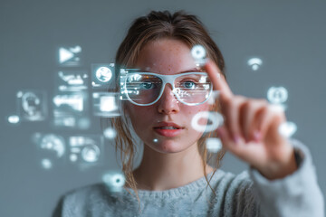 Young woman interacting with futuristic virtual interface