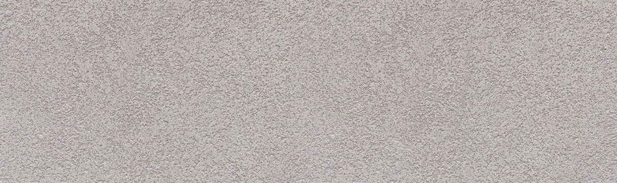 Gray stucco wall showing rough textured surface
