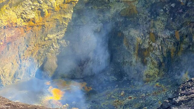 The crater of the volcano on Mount Bromo, and sulfur fumes rise in the air in East Java. The volcano is located inside the Tengger Caldera. An active volcano in Indonesia. 4К