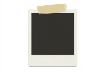 Blank instant camera film frame taped to a transparent background representing nostalgia and vintage memories